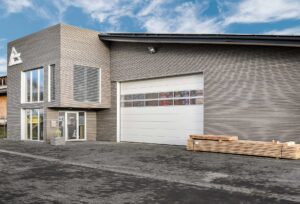 Commercial building with wooden facade and sectional gate
