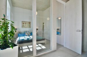 Bedroom with glass wall after the renovation