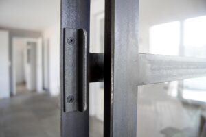 Interior in the unfinished building with a dark steel support