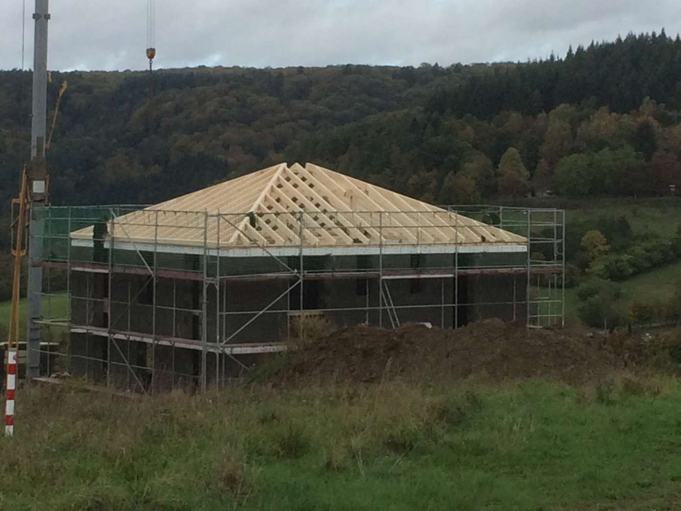 New roof structure on a prefabricated structure in front of the Eifel landscape